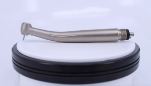 Dental high-speed handpiece showing the professional dental tool with sleek metallic design and precision head for dental procedures