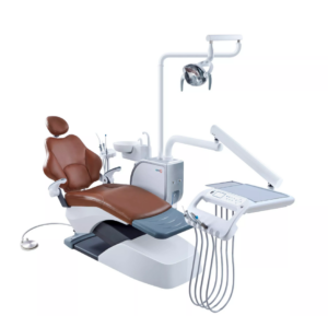 A side view of a brown and white dental chair with an attached overhead light and instrument tray, on a white background