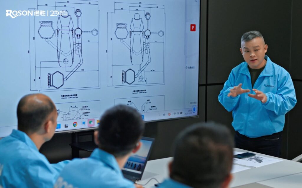 R&D team discussing dental product design, innovation for practice, detailed technical drawings