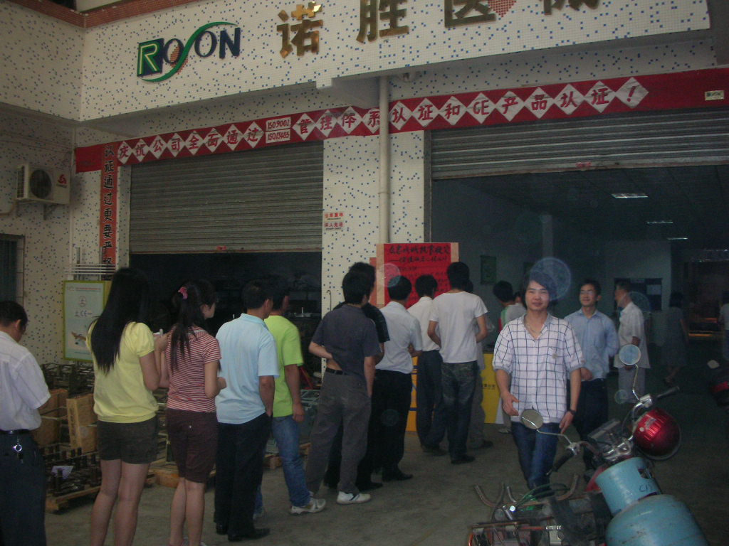 ROSON dental tech company entrance with people, focusing on quality and innovation in dental equipment