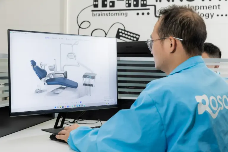 ROSON R&D team member designs dental chair prototype, brainstorming new innovation for practice.