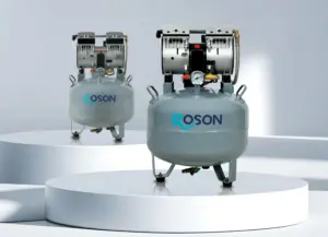 Two ROSON dental air compressors with dual motors, displayed on white circular platforms in a modern, minimalistic setting.