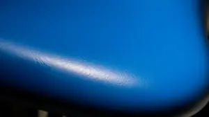 Close-up of blue dental chair upholstery showing texture and surface detail