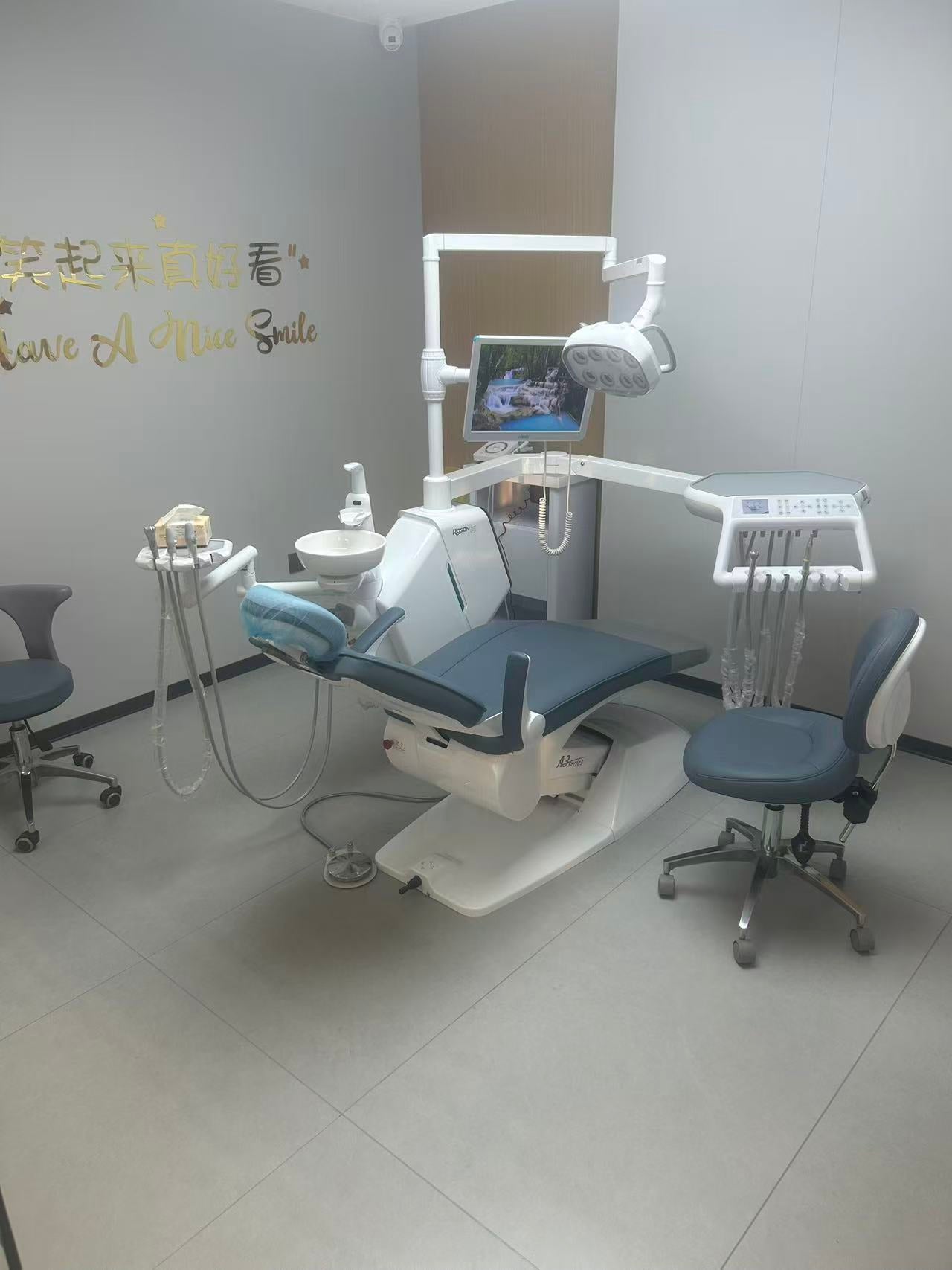 A wall-mounted pressure gauge and regulator for a dental air system, showing precise control over air delivery.